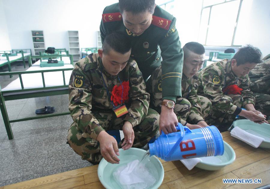 Newly recruited para-military policemen wash their faces upon their arrival at their barrack in Hohhot, north China's Inner Mongolia Autonomous Region, Dec. 12, 2012. Newly recruited soldiers of People's Liberation Army (PLA) and para-military policemen joined their units around the country recently. (Xinhua/Zhang Fan) 