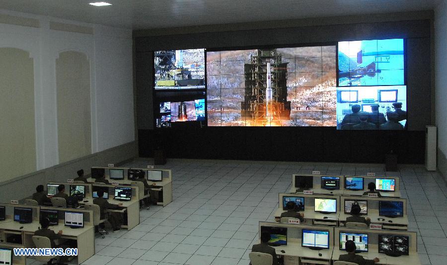 Photo released by the official KCNA news agency of the Democratic People's Republic of Korea (DPRK) on Dec. 12, 2012 shows technicians monitoring the launching of the satellite Kwangmyongsong-3 at the satellite control center. According to the KCNA, the second version of Kwangmyongsong-3 was launched by an Unha-3 carrier rocket at 9:49 a.m. local time (0049 GMT) Wednesday from the Sohae Space Center in Cholsan County, North Phyongan Province, and entered the preset orbit. (Xinhua/KCNA)