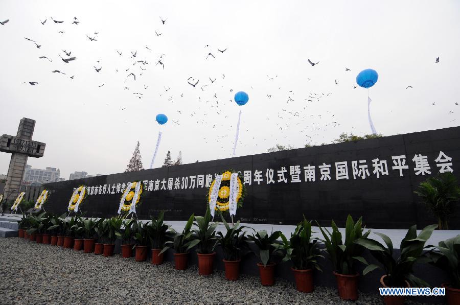Doves as a symbol of peace are released during a memorial ceremony at the Memorial Hall of the Victims in Nanjing Massacre by Japanese Invaders in Nanjing, capital of east China's Jiangsu Province, Dec. 13, 2012, to mark the 75th anniversary of the Nanjing Massacre. (Xinhua/Shen Peng)