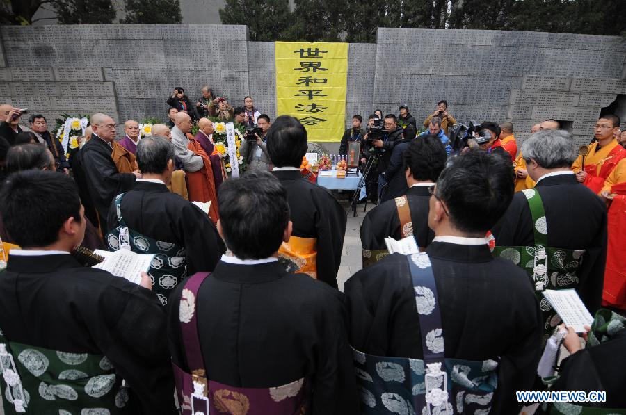 Japanese Buddhist monks chant mantras for Nanjing Massacre victims during a religious service at the Memorial Hall of the Victims in Nanjing Massacre by Japanese Invaders in Nanjing, capital of east China's Jiangsu Province, Dec. 13, 2012, to mark the 75th anniversary of the Nanjing Massacre. (Xinhua/Shen Peng)