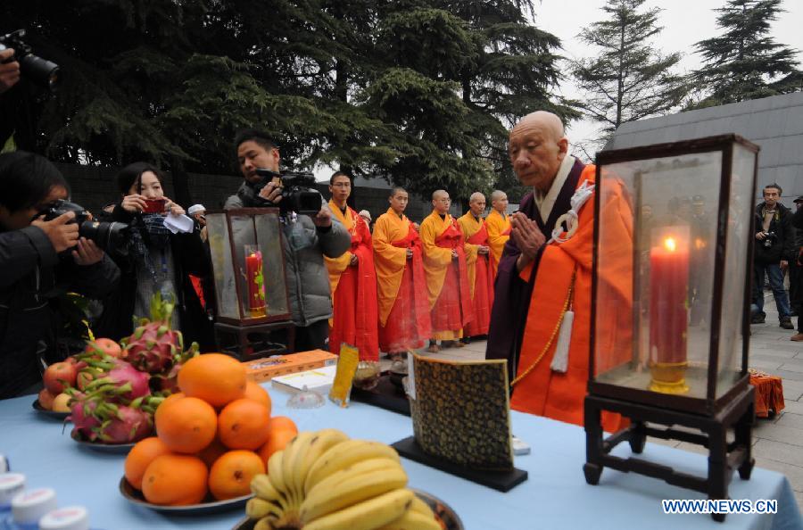 A Japanese Buddhist monk chants mantras for Nanjing Massacre victims during a religious service at the Memorial Hall of the Victims in Nanjing Massacre by Japanese Invaders in Nanjing, capital of east China's Jiangsu Province, Dec. 13, 2012, to mark the 75th anniversary of the Nanjing Massacre. (Xinhua/Shen Peng)