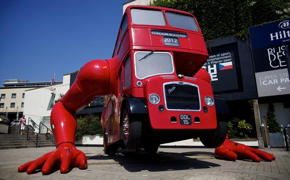 A London double-decker bus doing push-ups with humanoid arms, known as “London Booster”, designed and converted by Czech artist David Cerny. (AFP/Andrew Cowie)