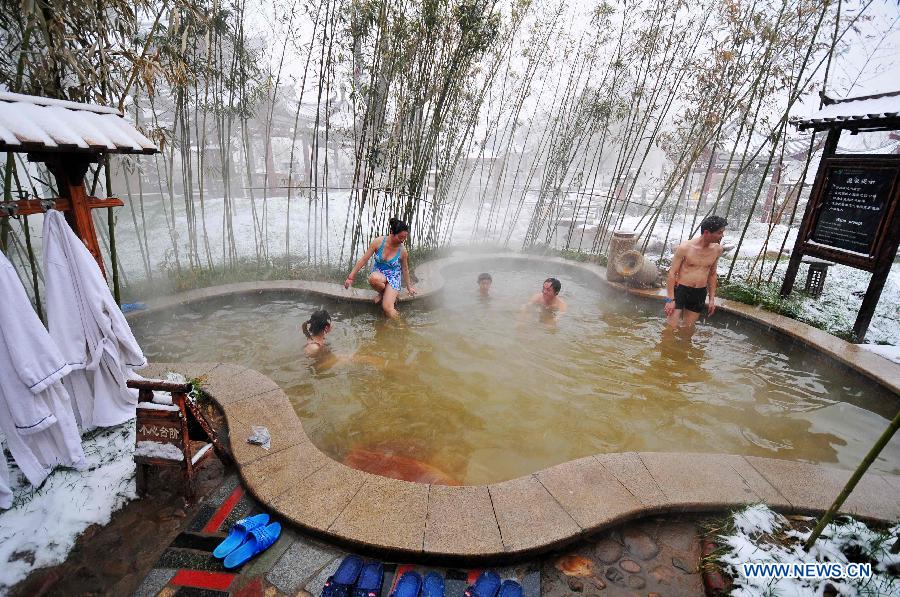 People soak in the hotspring in Xingtai, north China's Hebei Province, Dec. 13, 2012. Local people went to hotspring during snowy days. (Xinhua/Chen Lei)