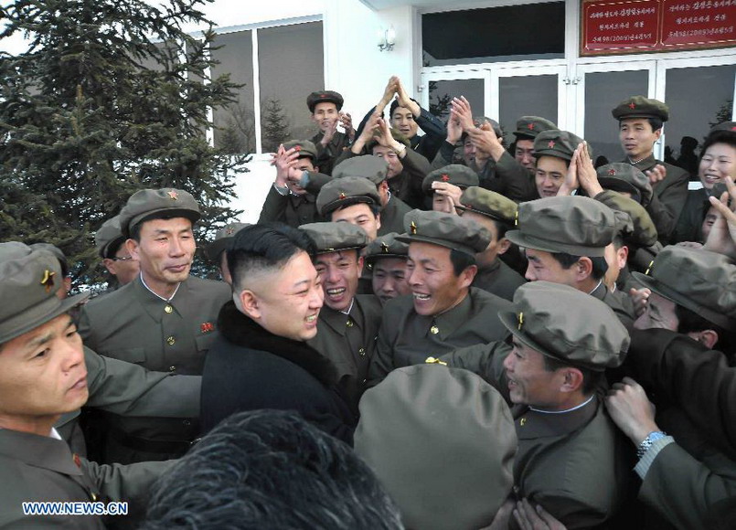 This photo provided by KCNA on Dec. 14, 2012 shows Kim Jong Un (C), top leader of the Democratic People's Republic of Korea (DPRK), celebrates with people after the successful launch of Kwangmyongsong-3 satellite at the Pyongyang General Satellite Control Command Center on Dec. 12, 2012.  (Xinhua/KCNA)