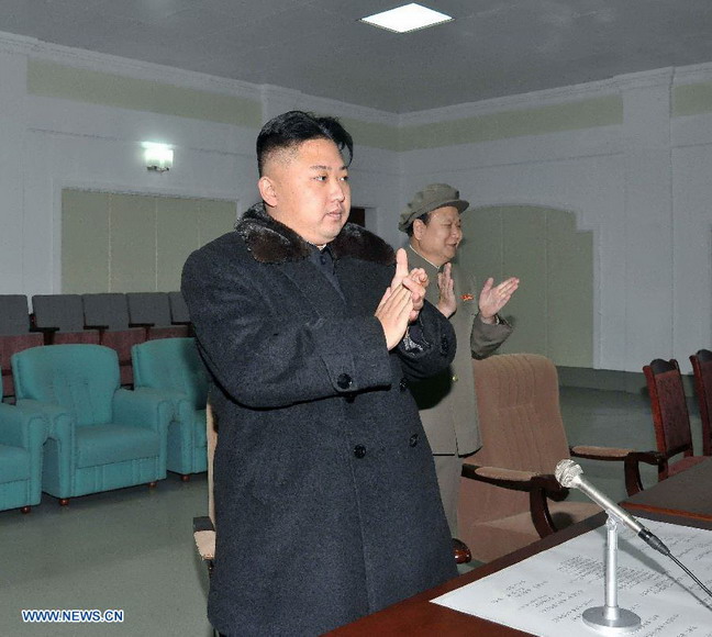 This photo provided by KCNA on Dec. 14, 2012 shows Kim Jong Un (Front), top leader of the Democratic People's Republic of Korea (DPRK), applauds after the successful launch of Kwangmyongsong-3 satellite at the Pyongyang General Satellite Control Command Center on Dec. 12, 2012.(Xinhua/KCNA) 