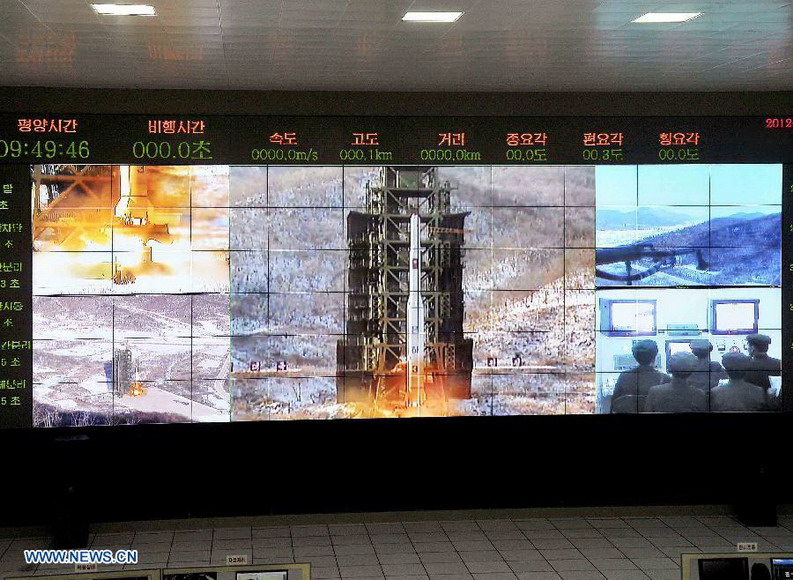 This photo provided by KCNA on Dec. 14, 2012 shows the launch of Kwangmyongsong-3 satellite at the Pyongyang General Satellite Control Command Center on Dec. 12, 2012.  (Xinhua/KCNA) 