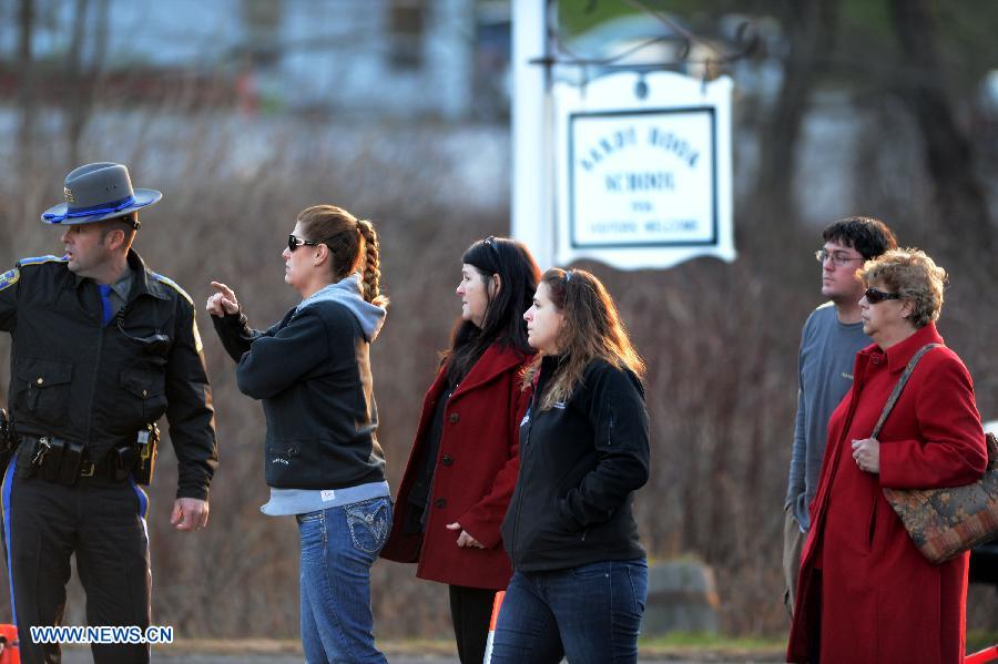 Family members of students of the Sandy Hook Elementary School get updated information from the police after the fatal school shooting in Newtown, Connecticut, the United States, Dec. 14, 2012. Police in U.S. state Connecticut said Friday that 18 children died on the scene at the school shooting here in Sandy Hook Elementary School, two more died later in the hospital. All together 8 adults were also dead. (Xinhua/Wang Lei) 