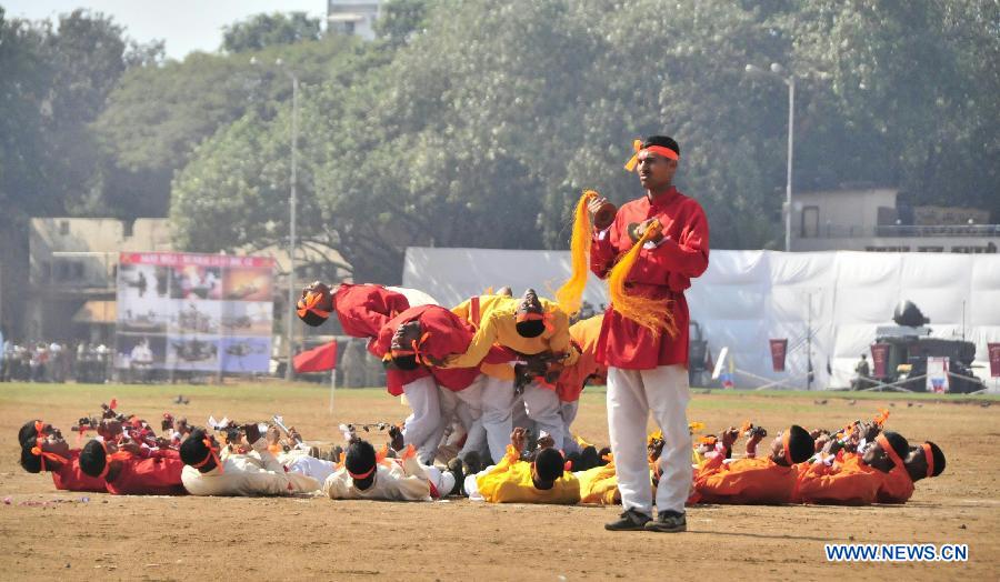 Indian soldiers dance during a military drill and arms exhibition at Shivaji park in Mumbai, India, on Dec. 15, 2012. A troop of Indian Defense Ministry held the military drill and arms exhibition here to raise the public awareness of Indian army and military affairs on Saturday. (Xinhua/Wang Ping)
