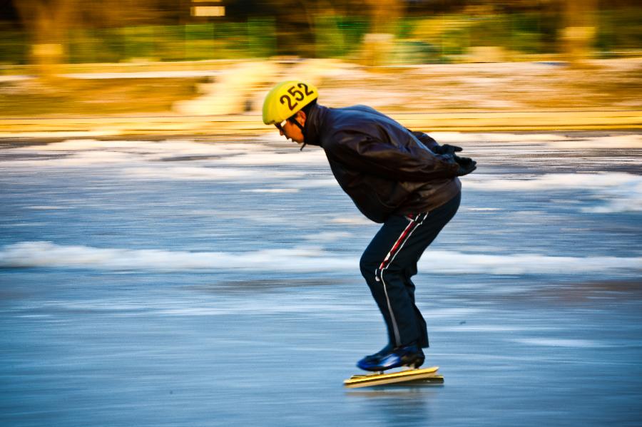 A skater enjoys himself upon the ice in Taoranting Park in Beijing, capital of China, Dec. 17, 2012. (Xinhua/Zhang Cheng) 