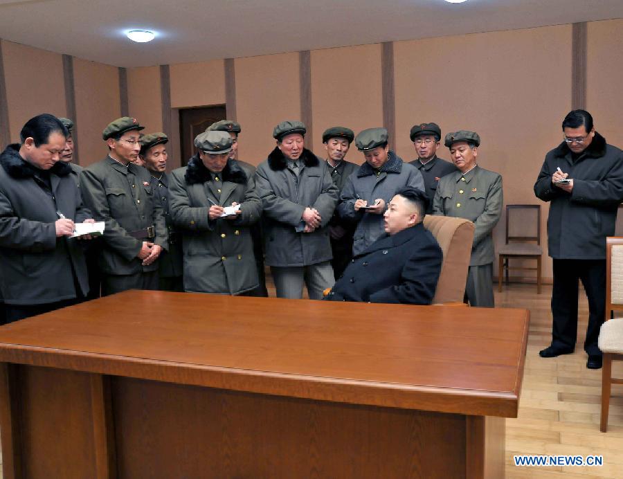 Photo released by Korean Central News Agency (KCNA) on Dec. 16, 2012 shows Kim Jong Un (Front), top leader of the Democratic People's Republic of Korea (DPRK), congratulate recently on scientific workers of the second Kwangmyongsong-3 satellite launch project at Sohae Space Center in Cholsan County, North Phyongan Province, DPRK. (Xinhua/KCNA) 