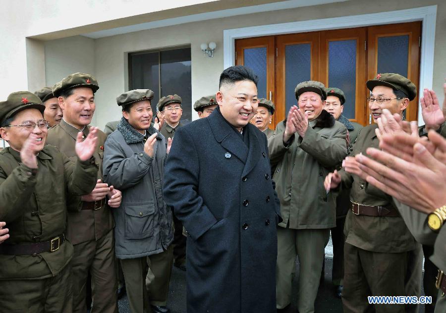 Photo released by Korean Central News Agency (KCNA) on Dec. 16, 2012 shows Kim Jong Un (C), top leader of the Democratic People's Republic of Korea (DPRK), congratulate recently on scientific workers of the second Kwangmyongsong-3 satellite launch project at Sohae Space Center in Cholsan County, North Phyongan Province, DPRK. (Xinhua/KCNA) 