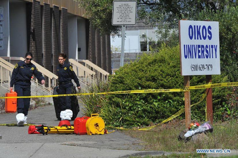 Police investigators work at Oikos University, the site of an shooting accident in Oakland in the state of California, the United States, April 3, 2012. (Xinhua/Liu Yilin)
