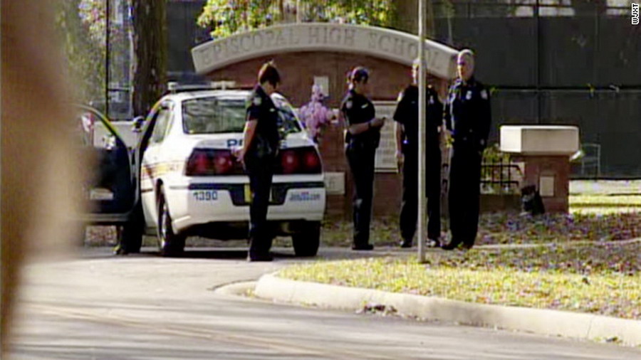 Police arrive on the scene at Episcopal High School, where police said the headmistress was killed by a fired employee. (Photo/CNN)