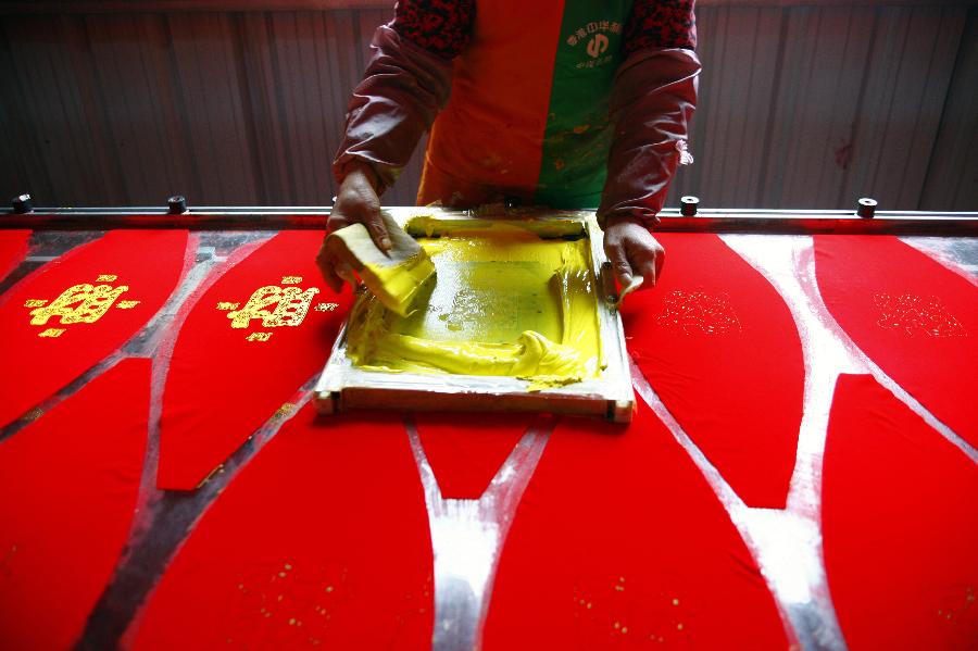 Villagers make Chinese lanterns in Yaxi Village of Xianju County, east China's Zhejiang Province, Dec. 18, 2012. As the Spring Festival approaches, workers in Yaxi Village are busy making lanterns, a traditional decoration for Spring Festival in China. (Xinhua/Xu Yu) 