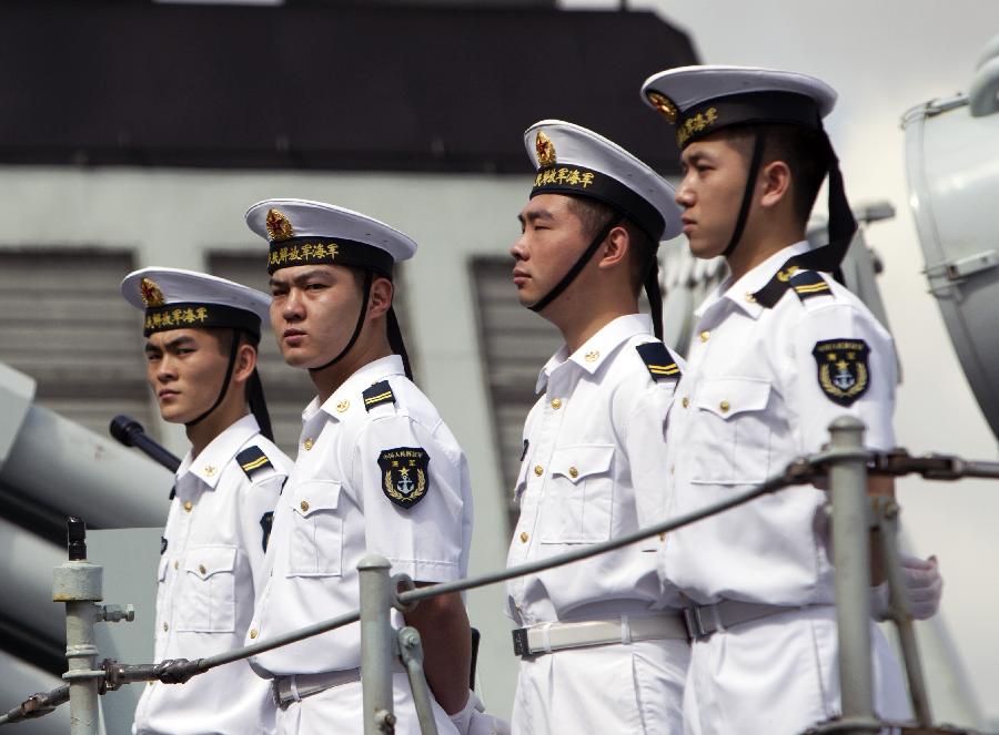 Soldiers stand on Yi Yang, one of the three visiting Chinese navy ships, upon their arrival in Sydney, Australia, on Dec. 18, 2012. Three Chinese navy ships returning home from counter-piracy operations in the Gulf of Aden have arrived in Sydney as part of a four day port visit, local media reported on Tuesday. (Xinhua/Jin Linpeng) 