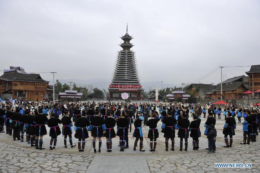 People of the Dong ethnic group take part in an ancestor-worshipping ritual during the Sama Festival in Rongjiang County, southwest China's Guizhou Province, Dec. 19, 2012. As a part of the ongoing celebration of the Sama Festival, an ancient traditional festival commemorating the woman ancestor, a ritual was held on Wednesday to worship a heroine ancestor of the group named Sama. The festival will last untill Dec. 20. (Xinhua/Ou Dongqu) 