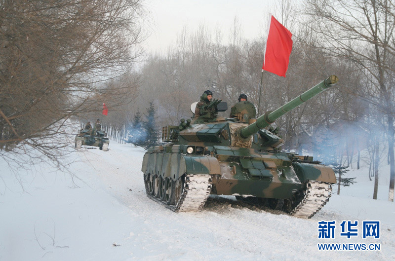 An armored regiment under the Shenyang Military Area Command of the Chinese People's Liberation Army (PLA) took its troops to unfamiliar area on December 16, 2012 to conduct drill on such subjects as rapid maneuvering and coordination of infantrymen and tanks, in a bid to temper its troops in an all-round way. (Xinhua/Xu Zhilin)