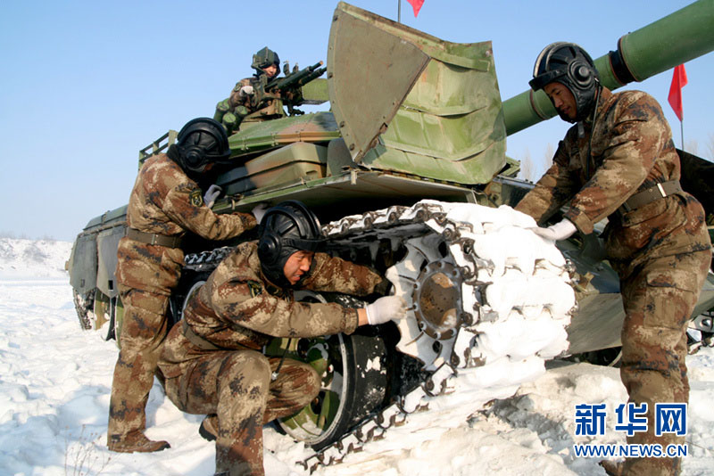 An armored regiment under the Shenyang Military Area Command of the Chinese People's Liberation Army (PLA) took its troops to unfamiliar area on December 16, 2012 to conduct drill on such subjects as rapid maneuvering and coordination of infantrymen and tanks, in a bid to temper its troops in an all-round way. (Xinhua/Xu Zhilin)