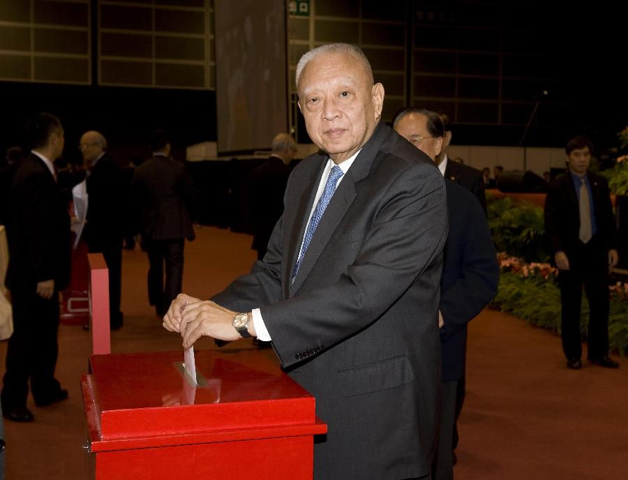 Member of the presidium Tung Chee-hwa votes at the Conference for Electing Deputies of the Hong Kong Special Administrative Region (HKSAR) to the 12th National People's Congress (NPC) in Hong Kong, south China, Dec. 19, 2012. (Xinhua/Lui Siu Wai)