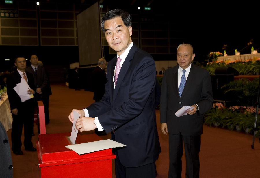 Chairman of the presidium CY Leung votes at the Conference for Electing Deputies of the Hong Kong Special Administrative Region (HKSAR) to the 12th National People's Congress (NPC) in Hong Kong, south China, Dec. 19, 2012.  (Xinhua/Lui Siu Wai)