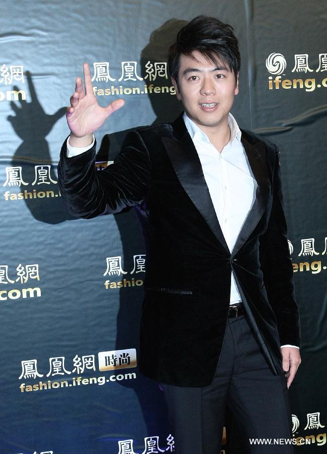 Pianist Lang Lang poses on a red carpet during a fashion event "Phoenix Fashion Choice" in Beijing, capital of China, Dec. 19, 2012. The fashion event kicked off here Wednesday. (Xinhua/Li Fangyu) 