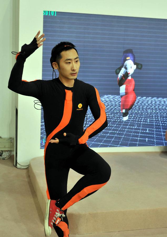 A performer shows the 3D motion-capture technology during the 7th China (Beijing) International Cultural and Creative Industry Expo (ICCIE) in Beijing, capital of China, Dec, 20, 2012. The expo, which opened here on Thursday, attracted some 50 delegations from 6 international organizations and 15 countries and regions. (Xinhua/Li Wen) 