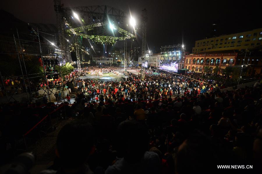 Participants perform during a parade to mark the 13th anniversary of the establishment of the Macao Special Administrative Region (SAR) in Macao, south China, Dec. 20, 2012. Artists and groups from all over the world, accompanied by numerous local talents, set out on their performing journey from the city's iconic Ruins of St. Paul's and across the city. (Xinhua/Cheong Kam Ka) 