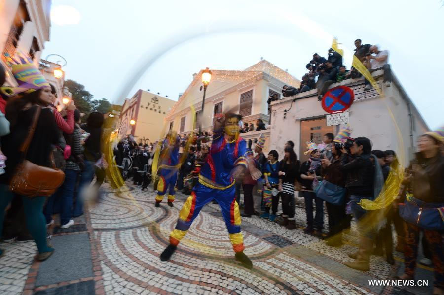 Participants perform during a parade to mark the 13th anniversary of the establishment of the Macao Special Administrative Region (SAR) in Macao, south China, Dec. 20, 2012. Artists and groups from all over the world, accompanied by numerous local talents, set out on their performing journey from the city's iconic Ruins of St. Paul's and across the city. (Xinhua/Cheong Kam Ka)