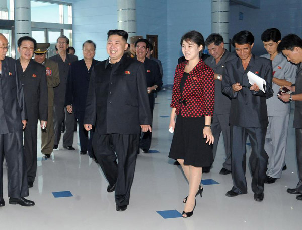 This photo released on July 25, 2012 by KCNA, State media of the Democratic People's Republic of Korea (DPRK), shows Kim Jong Un, accompanied by his wife Ri Sol Ju, inspects an amusement park in Pyongyang, capital of DPRK. The official KCNA news agency confirmed Wednesday that top leader Kim Jong Un has been married. (Xinhua/KCNA)