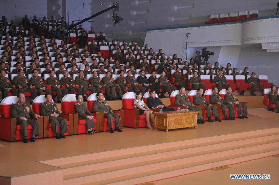 Photo released by KCNA news agency on Aug. 26, 2012 shows top leader of the Democratic People's Republic of Korea (DPRK) Kim Jong Un (6th L, front row) watching a performance by the Moranbong Band to celebrate the 52nd anniversary of "The August 25", which commemorates the late leader Kim Jong Il's start of the Songun (military first) revolutionary leadership. (Xinhua/KCNA)