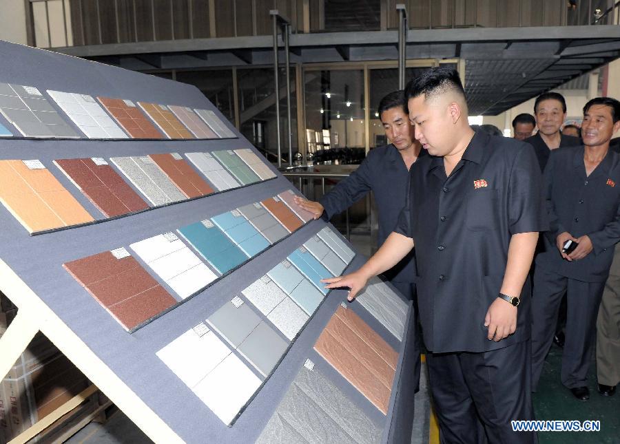 Photo released by Korean Central News Agency (KCNA) on Sept. 3, 2012 shows Kim Jong Un (front), top leader of the Democratic People's Republic of Korea (DPRK), inspecting the Taedonggang tile factory in Pyongyang. (Xinhua/KCNA) 