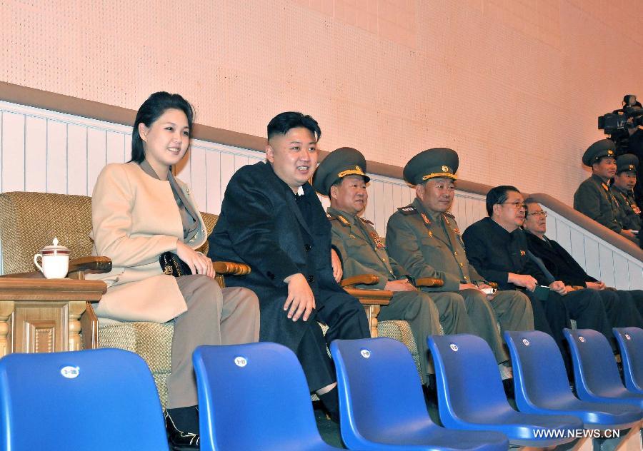 Photo released by Korean Central News Agency (KCNA) on Nov. 7, 2012 shows Kim Jong Un (2nd L), top leader of the Democratic People's Republic of Korea (DPRK), and his wife Ri Sol-ju (L), watching a women's volleyball match between the Pongae team and the Pyongyang team. (Xinhua/KCNA) 
