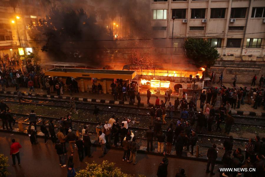Buses are seen ablaze during clashes between Islamists and their opponents in Egypt's northern seaside city of Alexandria on Dec. 21, 2012. The clashes came one day ahead of the second round of the country's constitutional referendum. (Xinhua/Wissam Nassar) 