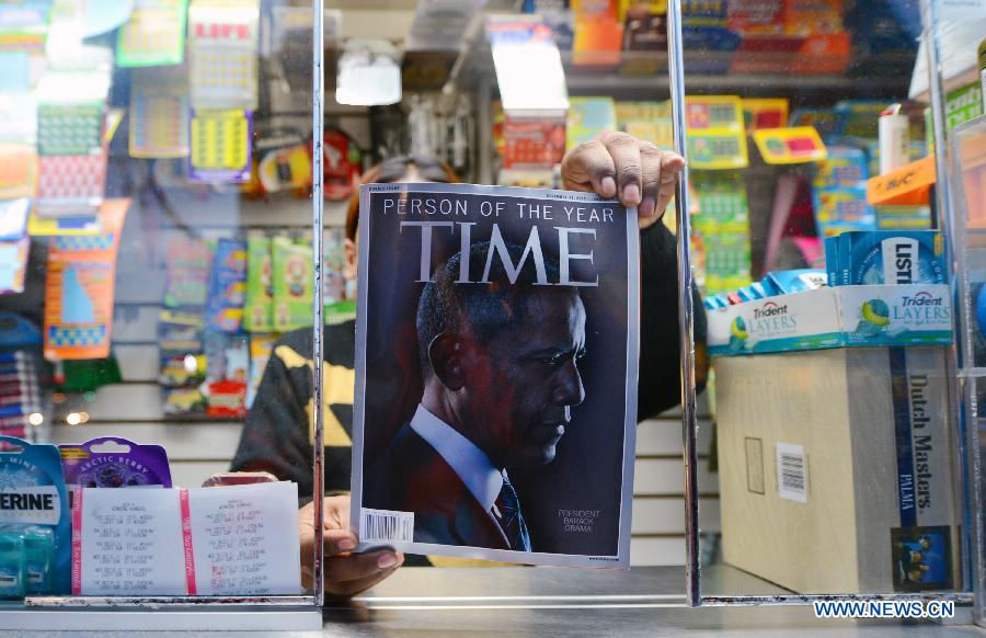 Photo taken on Dec. 21, 2012 in Washionton shows the Time magazine with the cover of Obama who is the person of the year in 2012. Time magazine on Wednesday named the recently re-elected US President Barack Obama as its person of the year for 2012 -- the second time it has accorded him this honor. (Xinhua/Wang Lei)  