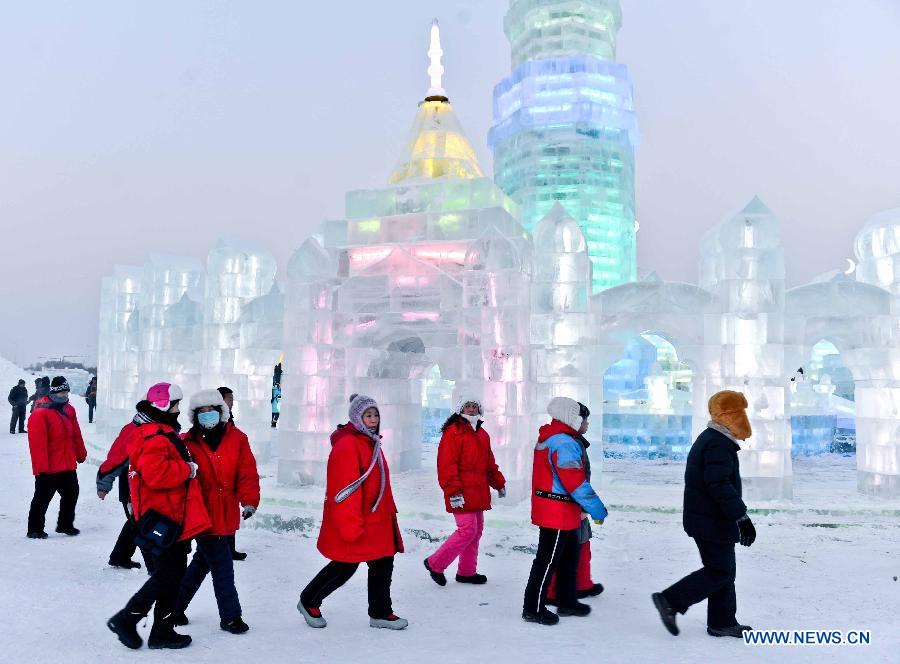 Tourists walk around at the 29th Harbin International Ice and Snow Festival in Harbin, capital of northeast China's Heilongjiang Province, Dec. 23, 2012. The festival kicked off at the Harbin Ice and Snow World on Sunday. (Xinhua/Wang Song) 