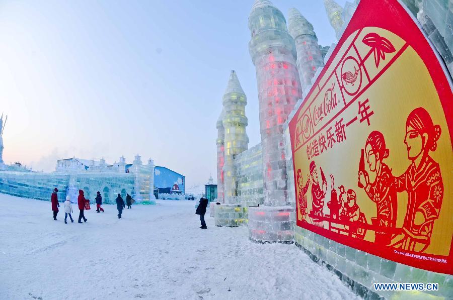 Tourists look at snow sculptures at the 29th Harbin International Ice and Snow Festival in Harbin, capital of northeast China's Heilongjiang Province, Dec. 23, 2012. The festival kicked off at the Harbin Ice and Snow World on Sunday. (Xinhua/Wang Song)
