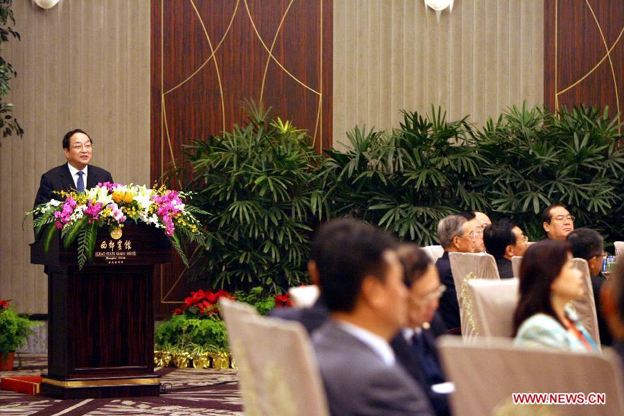 File photo taken on Dec. 20, 2008 shows Yu Zhengsheng (L) delivers a speech at a banquet held for Wu Poh-hsiung, chairman of the Kuomintang, and Lien Chan, honorary chairman of the Kuomintang, during the 4th Cross-Straits Economic, Trade and Cultural Forum in east China's Shanghai Municipality. (Xinhua/Liu Ying) 