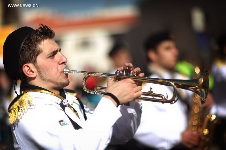 A man performs at the Church of the Nativity, traditionally believed to be the birthplace of Jesus Christ, as he attends the Christmas celebrations in the West Bank biblical town of Bethlehem on Dec. 24, 2012. (Xinhua/Fadi Arouri)