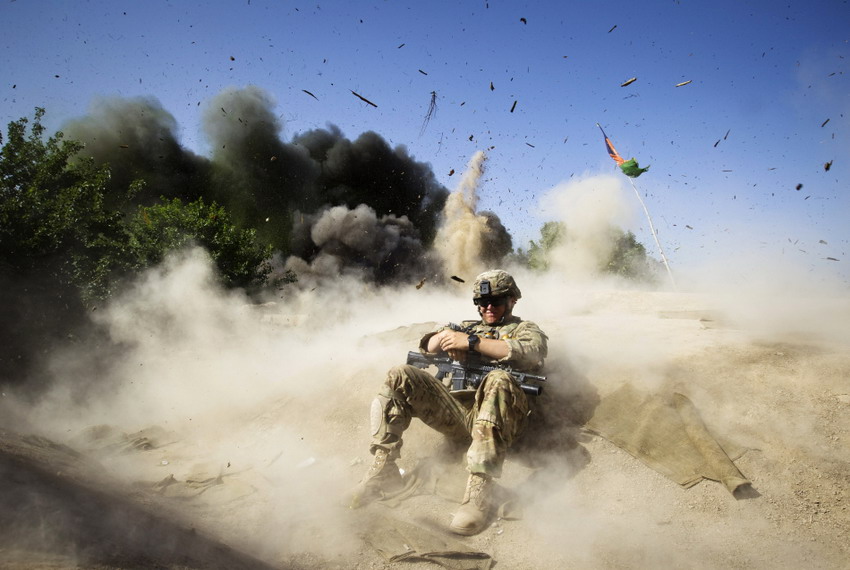 Jack Baldwin, the PVT of 508th special mission battalion, lies down while he is in control blasting, in Afghanistan on May 31, 2012.  (Reuters/Shamil Zhumatov)