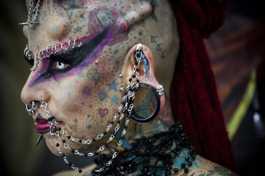 A lady, known as “female vampire”, poses for a photo at “Venezuelan Tattoo Exhibition of year 2012” on Jan 28, 2012. More than 200 tattoo artists from Venezuela, Argentina, Mexico and other countries were present.  (AFP /Leo Rsmire)