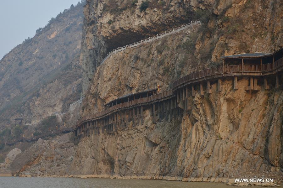 Photo taken on Dec. 26, 2012 shows a renovated section of ancient plank road above the Jialing River, a Yangtze tributary, in the Mingyue Gorge in Guangyuan, southwest China's Sichuan Province. (Xinhua/Pan Chaoyue) 