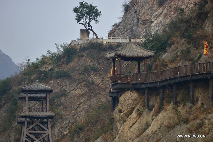 Photo taken on Dec. 26, 2012 shows a renovated section of ancient plank road above the Jialing River, a Yangtze tributary, in the Mingyue Gorge in Guangyuan, southwest China's Sichuan Province. (Xinhua/Pan Chaoyue)