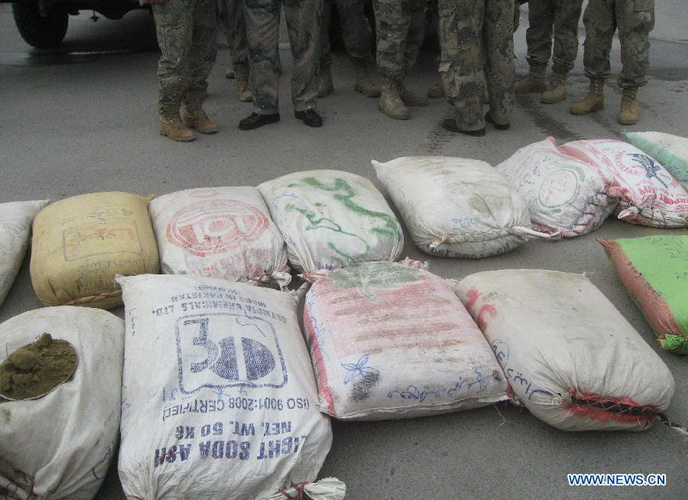 Bags of seized hashish are seen during a presentation by Afghan border police in east Afghanistan's Nangarhar Province, Dec. 27, 2012. Afghan border police captured around 800 kilograms of hashish during an operation in Nangarhar province. (Xinhua/Tahir Safi) 