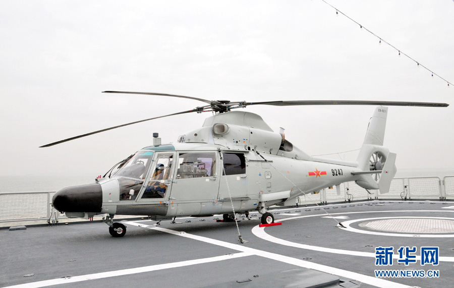 The "Guangzhou" guided missile destroyer under the South China Sea Fleet of the Navy of the Chinese People's Liberation Army (PLA) is open to the public on December 26, 2012. The photo features the scene of the Z-9 ship-borne helicopter. (Xinhua/An Chen)