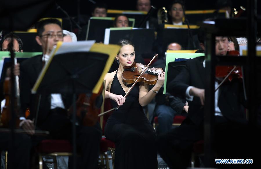 A Russian musician performs during the 1st ocean-themed new year concert at the Great Hall of the People in Beijing, capital of China, Dec. 27, 2012. The concert, with the participation of the Russia National Orchestra and the China National Orchestra, was held here on Thursday. (Xinhua/Wan Xiang)