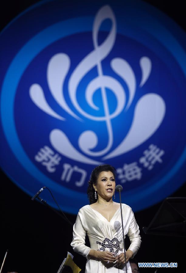 Singer Liang Ning performs during the 1st ocean-themed new year concert at the Great Hall of the People in Beijing, capital of China, Dec. 27, 2012. The concert, with the participation of the Russia National Orchestra and the China National Orchestra, was held here on Thursday. (Xinhua/Wan Xiang)
