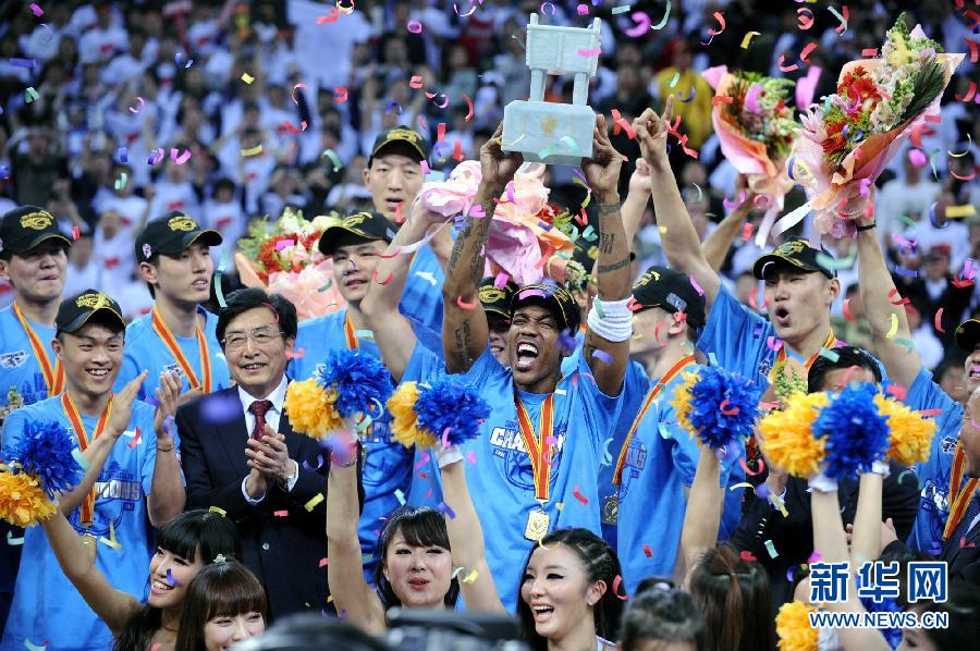 Beijing Ducks players celebrate their first-ever CBA title after beating defending Guangdong Hongyuan in the best-of-seven final series in Beijing on March 30, 2012.  (Xinhua)