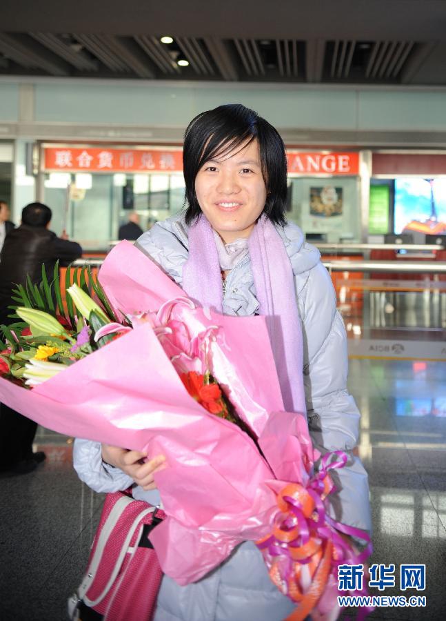 Hou Yifan arrives in Beijing after a historical victory over Hungarian Judit Polgar at the 10th Gibraltar Chess Festival, Feb 5, 2012.  (Xinhua)