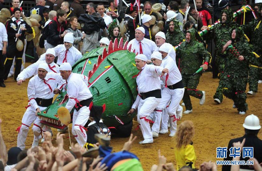 The “dragon” arrives during the “Ducasse de Mons festival” in Belgium on June 3, 2012. This festival originating in the fourth century depicts the combat between the St. George and the dragon, and is celebrated every year to commemorate St. George. It is recognized as one of the “Masterpieces of the Oral and Intangible Heritage of Humanity”.  (Xinhua/ Ye Pingfan)
