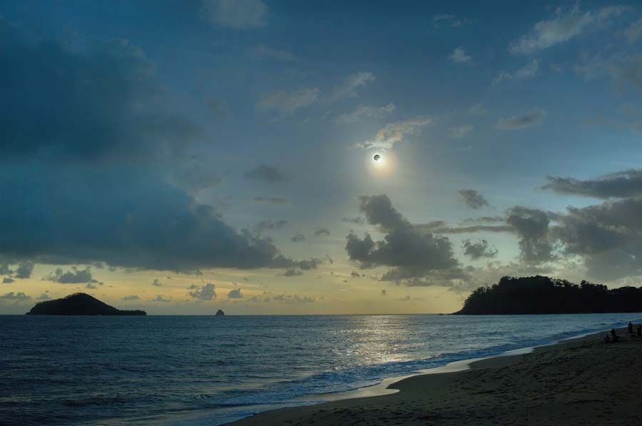 Like a Diamond in the Sky. A dark Sun hung over Queensland, Australia on Wednesday morning during a much anticipated total solar eclipse. Storm clouds threatened to spoil the view along the northern coast, but minutes before totality the clouds parted. (Photo/ NASA)